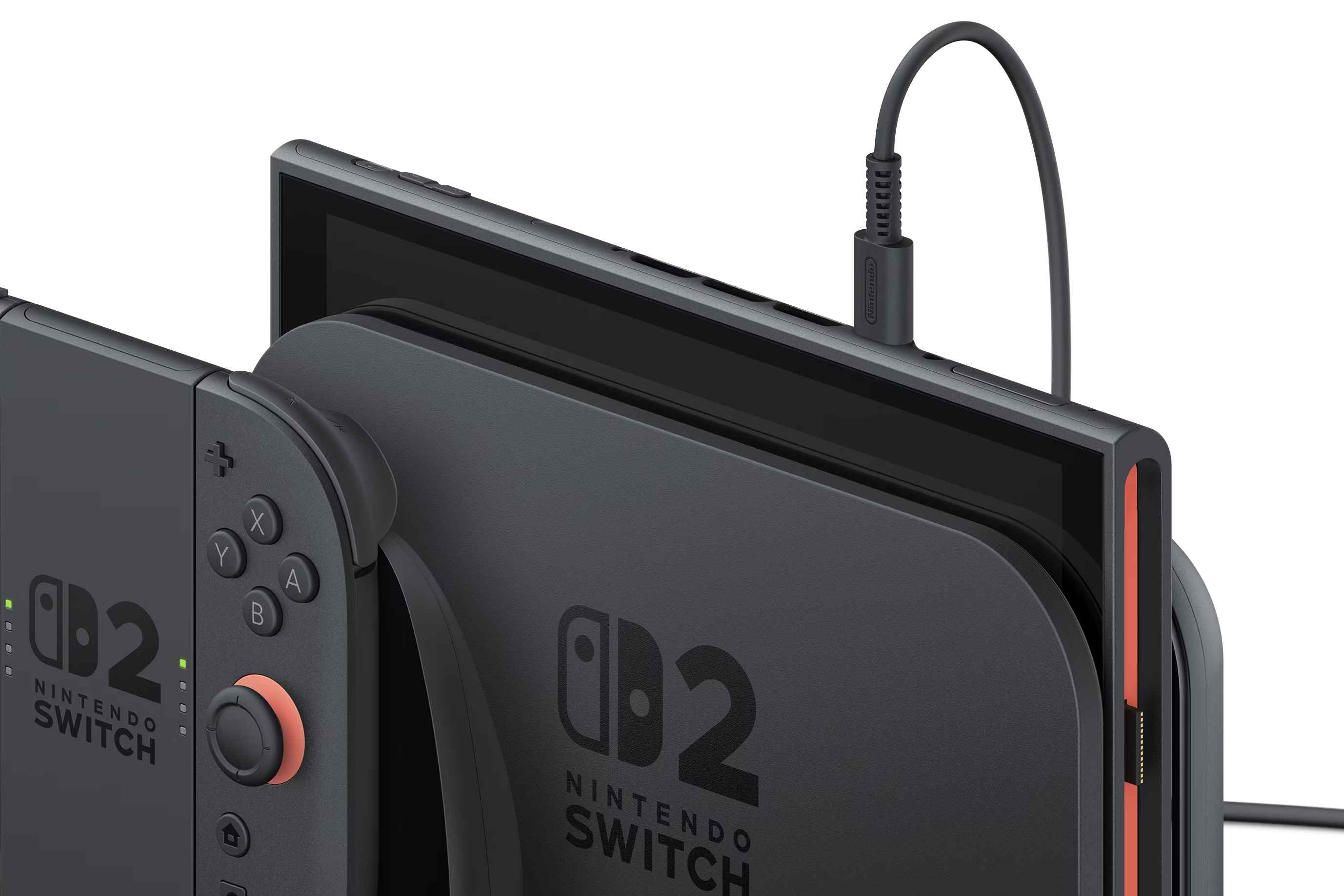 Zadokovaný Nintendo Switch 2 se zapojeným USB-C na horní hraně