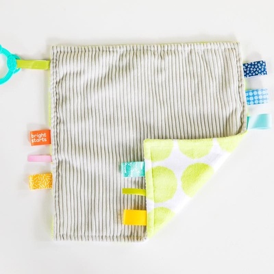 Bright Starts Dečka maznacia na C krúžku Little Taggies zelené bodky