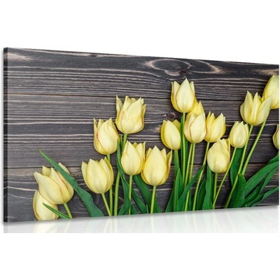 Obraz očarující žluté tulipány na dřevěném podkladě - 120x80