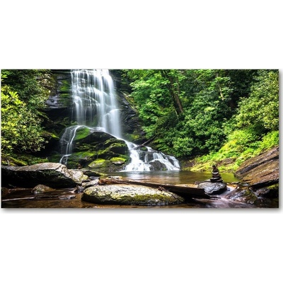 Foto obraz sklenený horizontálny Vodopád v lese 100x50 cm