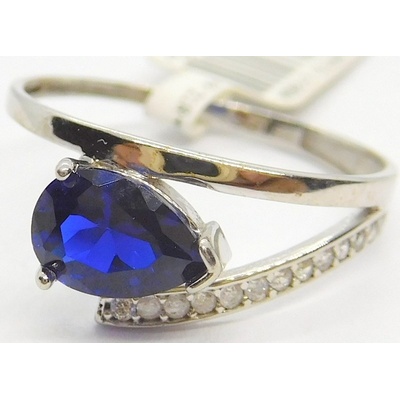 Klenoty Budín Zásnubní prsten z bílého zlata s modrým safírem 1161588