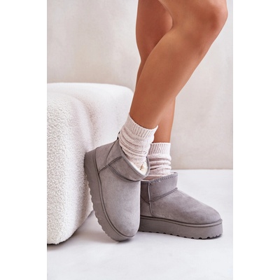 Women's snow boots on a platform lined with fur gray
