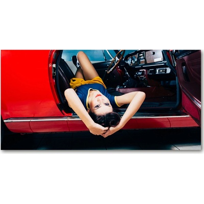 Foto obraz sklo tvrzené Žena v aute 100x50 cm