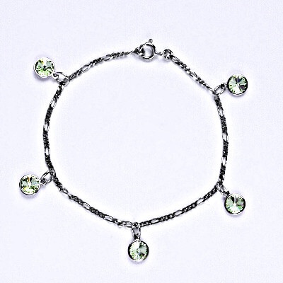 Čištín stříbrný se Swarovski krystaly chryzolite kolečka R 1336