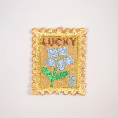 Takoy Nažehľovačka poštová známka Lucky žltá