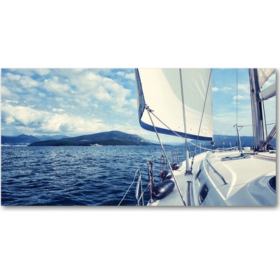 Foto obraz sklenený horizontálny Jachta na pozadí mora 100x50 cm