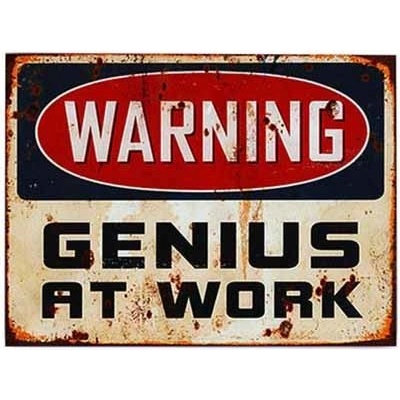 Plechová cedule Warning - Genius At Work