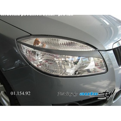 Škoda Fabia II - mračítka predných svetiel - lak