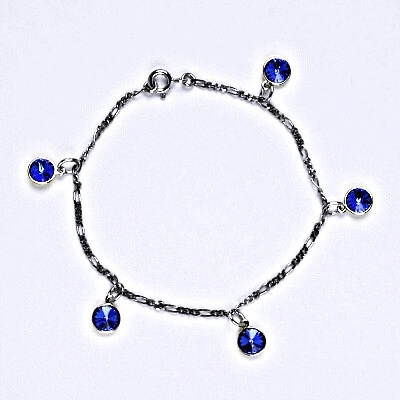 Čištín stříbrný se Swarovski krystaly saphire kolečka R 1336