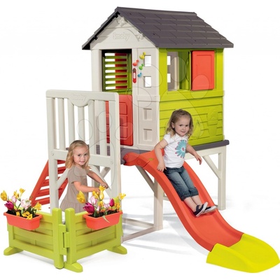Smoby Domeček na pilířích Pilings House s 1,5 m skluzavkou zvonkem a zahrádkou na kytičky