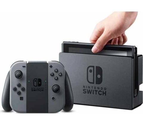 Nintendo Switch, neonově modré a neonově červené Joy-Con, v dokovací stanici.