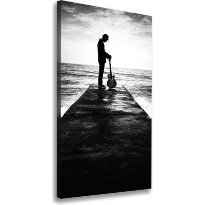 Vertikálny foto obraz na plátne Gitarista mólo 50x100 cm