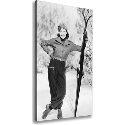 Vertikálny foto obraz na plátne Žena s lyžami 50x100 cm