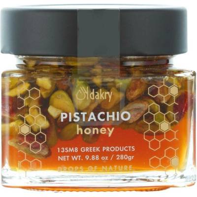 Dakry Olive Řecký med z pomerančových květů s pistáciemi Aigina PDO monoflorální citrusový med 28 % ořechů nepřehřívaný, minimálně zpracovaný