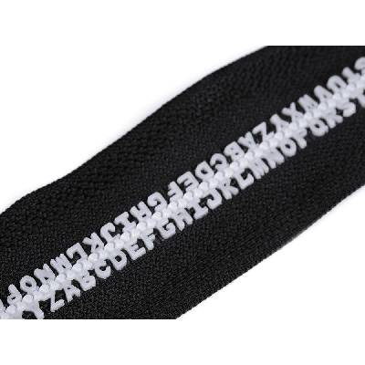 Kostěný zip šíře 5 mm délka 60 cm písmenka - černá