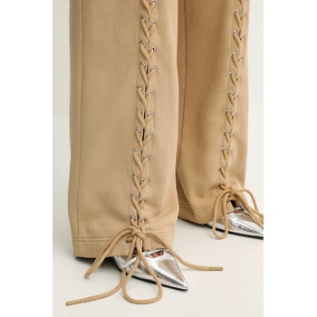 Rotate Памучен спортен панталон Rotate в бежово с изчистен дизайн 114389654 (114389654)