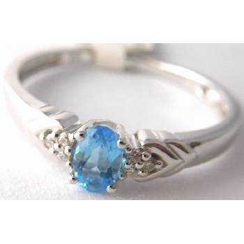 Klenoty Budín zásnubní prsten z bílého zlata s modrým topazem 3860450