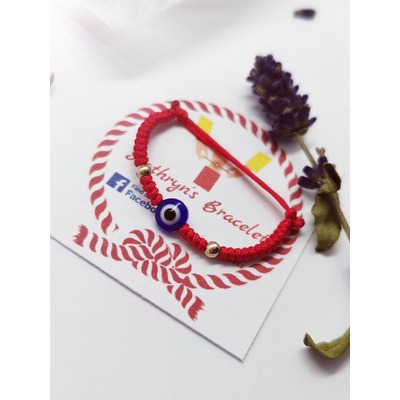 Златна гривна за бебе с червен конец